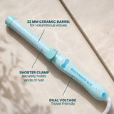 The Pastel Sky B1.25 rotating curling iron featuring a 32 MM barrel in a light blue color, ideal for creating voluminous waves.