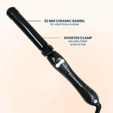 The Black Glitter B1.25 rotating curling iron featuring a 32 MM barrel in a black glitter finish, ideal for creating voluminous waves.
